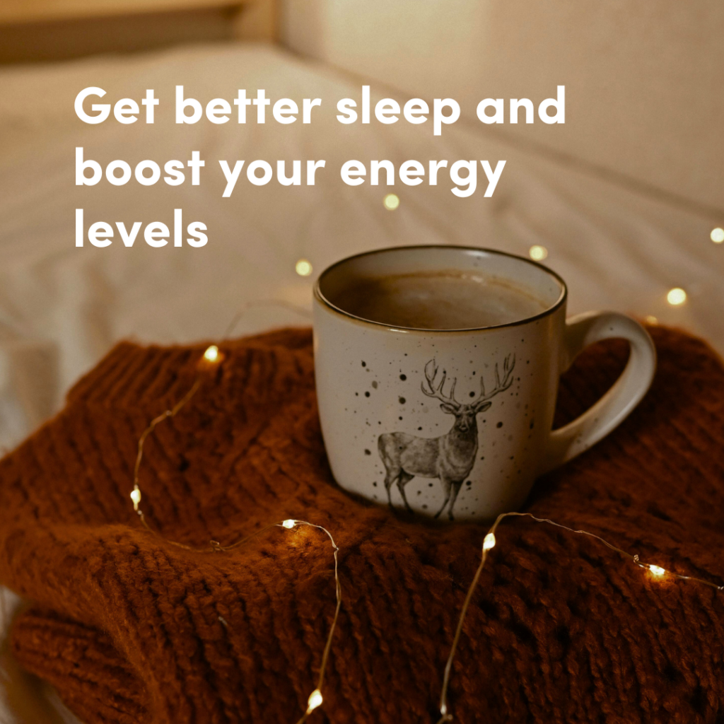 A warm coffee cup with a reindeer illustration, placed on a soft brown blanket with fairy lights, accompanied by the text 'Get better sleep and boost your energy levels.