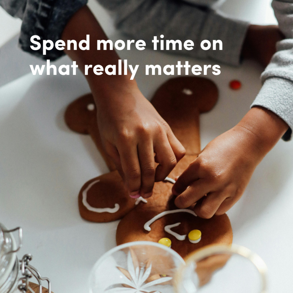 Two hands decorating a gingerbread cookie with icing and candies, with the text 'Spend more time on what really matters.'