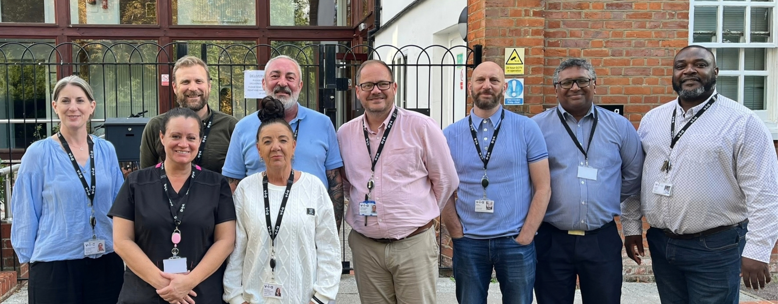 The Passmores House team standing together outside the building in Harlow on the day of the open day.