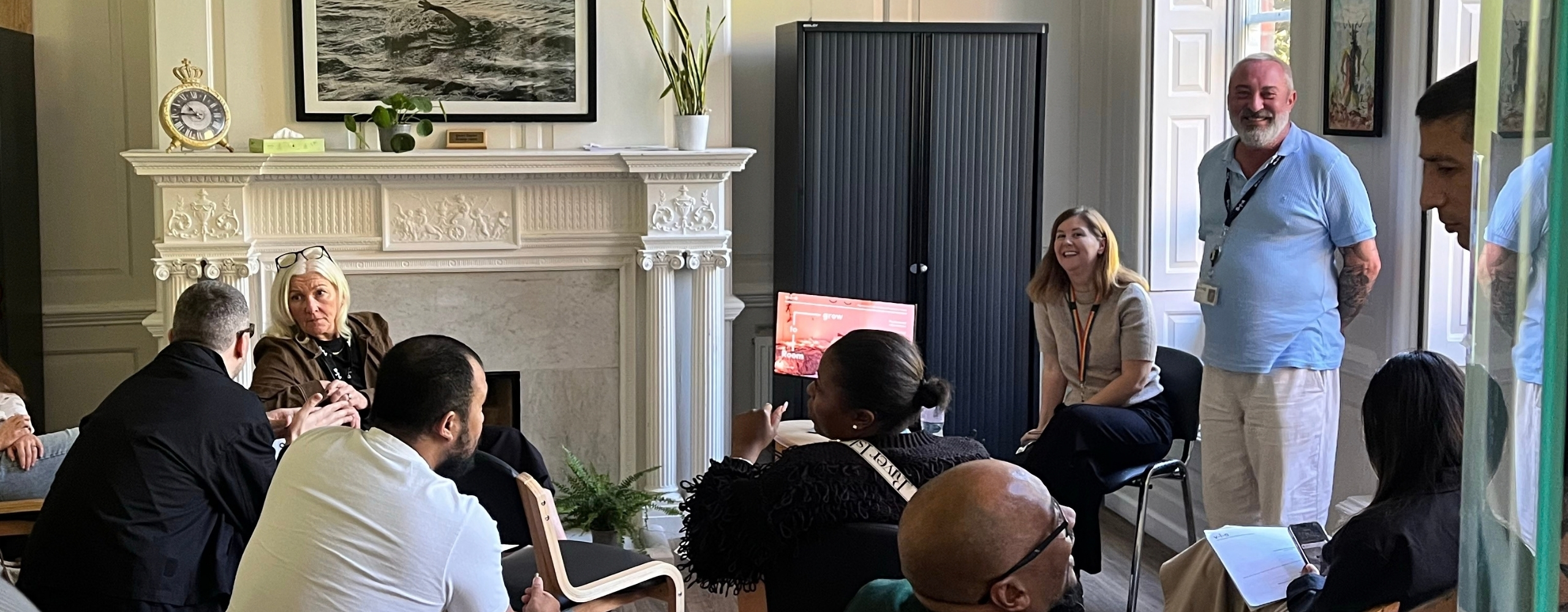 Visitors at a group talk during the Passmores House open day.